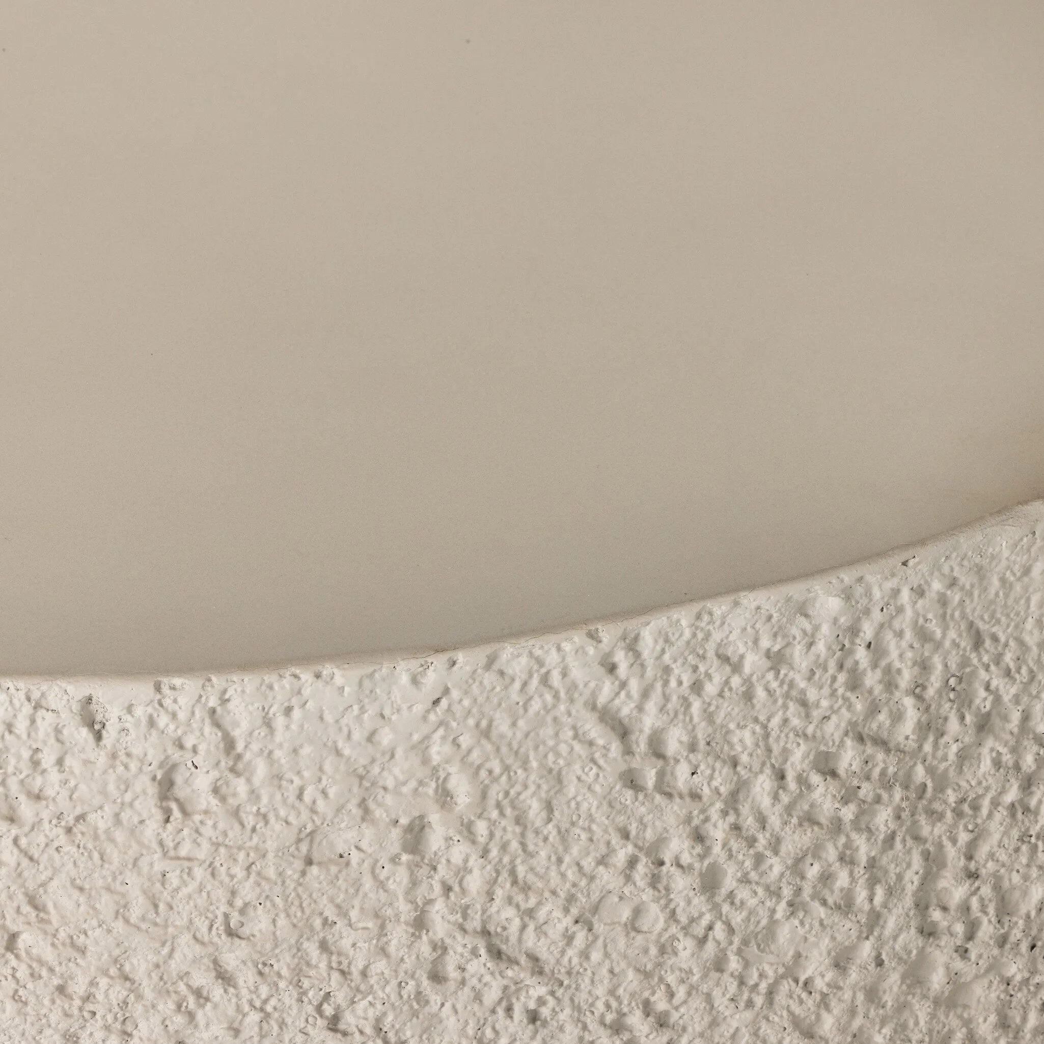 Heavy texture of pumice concrete with a smooth top sets this up as an essential transitional piece for any outdoor style. A statement cylindrical shape lifted by cutout legs contrasts bold design with an airy lightness. Cover or store indoors during inclement weather and when not in use Amethyst Home provides interior design, new home construction design consulting, vintage area rugs, and lighting in the Alpharetta metro area.