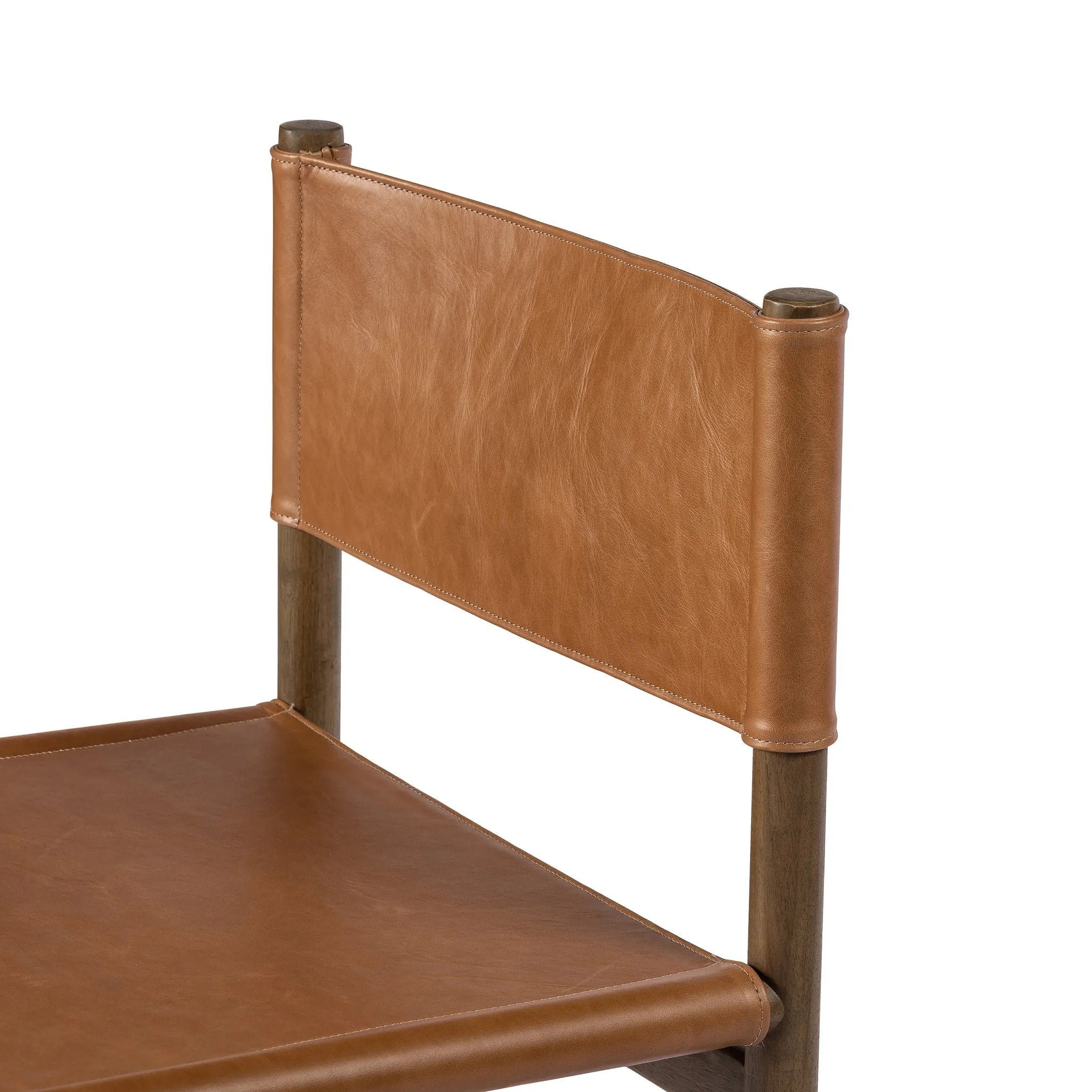 Solid parawood forms a simple, vintage-inspired frame for sling-style seating of top-grain leather exclusive to Four Hands Amethyst Home provides interior design, new home construction design consulting, vintage area rugs, and lighting in the Salt Lake City metro area.