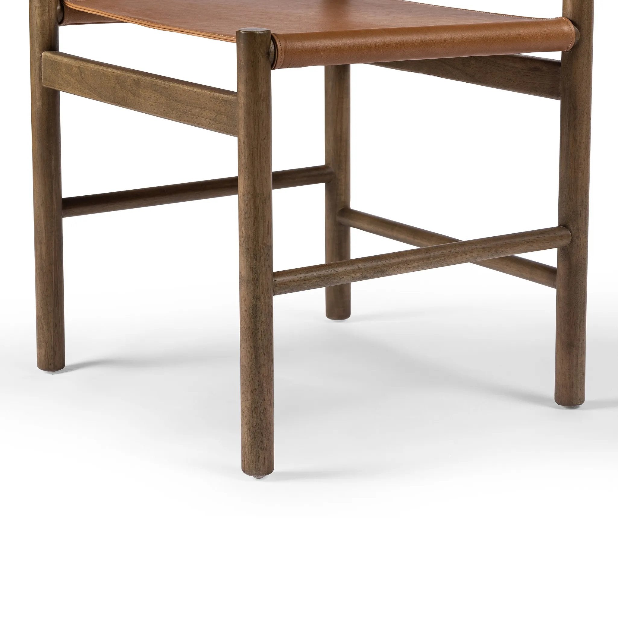 Solid parawood forms a simple, vintage-inspired frame for sling-style seating of top-grain leather exclusive to Four Hands Amethyst Home provides interior design, new home construction design consulting, vintage area rugs, and lighting in the Winter Garden metro area.