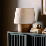 Featuring Kenoa Light Smoked Oak Veneer Table Lamp by Four Hands at Amethyst Home. Dramatic proportions and soft texture define this unique table lamp. Light, smoked oak shapes a cylinder base for an overscaled boucle shade, bringing a playful, monochromatic look to any space. Overall Dimensions: 15.50"w x 15.50"d x 17.00"h. Amethyst Home provides interior design, new home construction design consulting, vintage area rugs, and lighting in the Austin metro area.