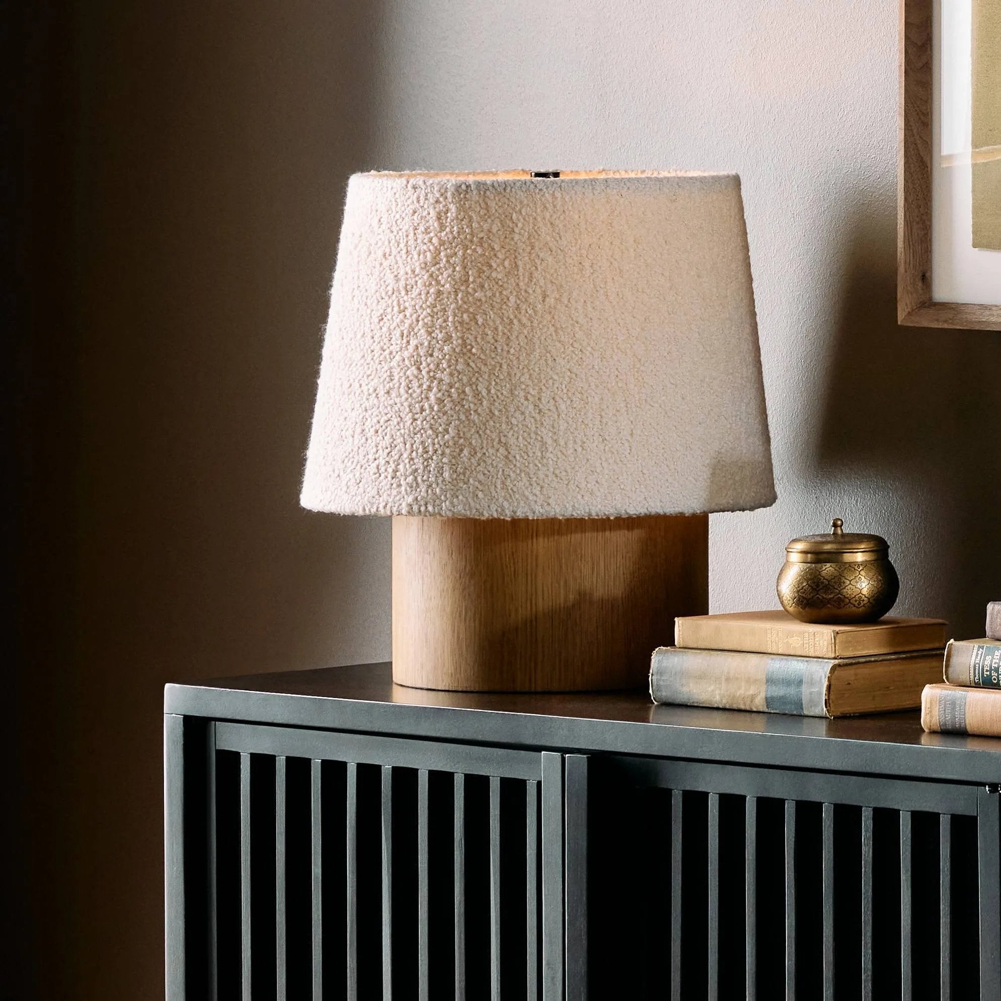 Featuring Kenoa Light Smoked Oak Veneer Table Lamp by Four Hands at Amethyst Home. Dramatic proportions and soft texture define this unique table lamp. Light, smoked oak shapes a cylinder base for an overscaled boucle shade, bringing a playful, monochromatic look to any space. Overall Dimensions: 15.50"w x 15.50"d x 17.00"h. Amethyst Home provides interior design, new home construction design consulting, vintage area rugs, and lighting in the Austin metro area.
