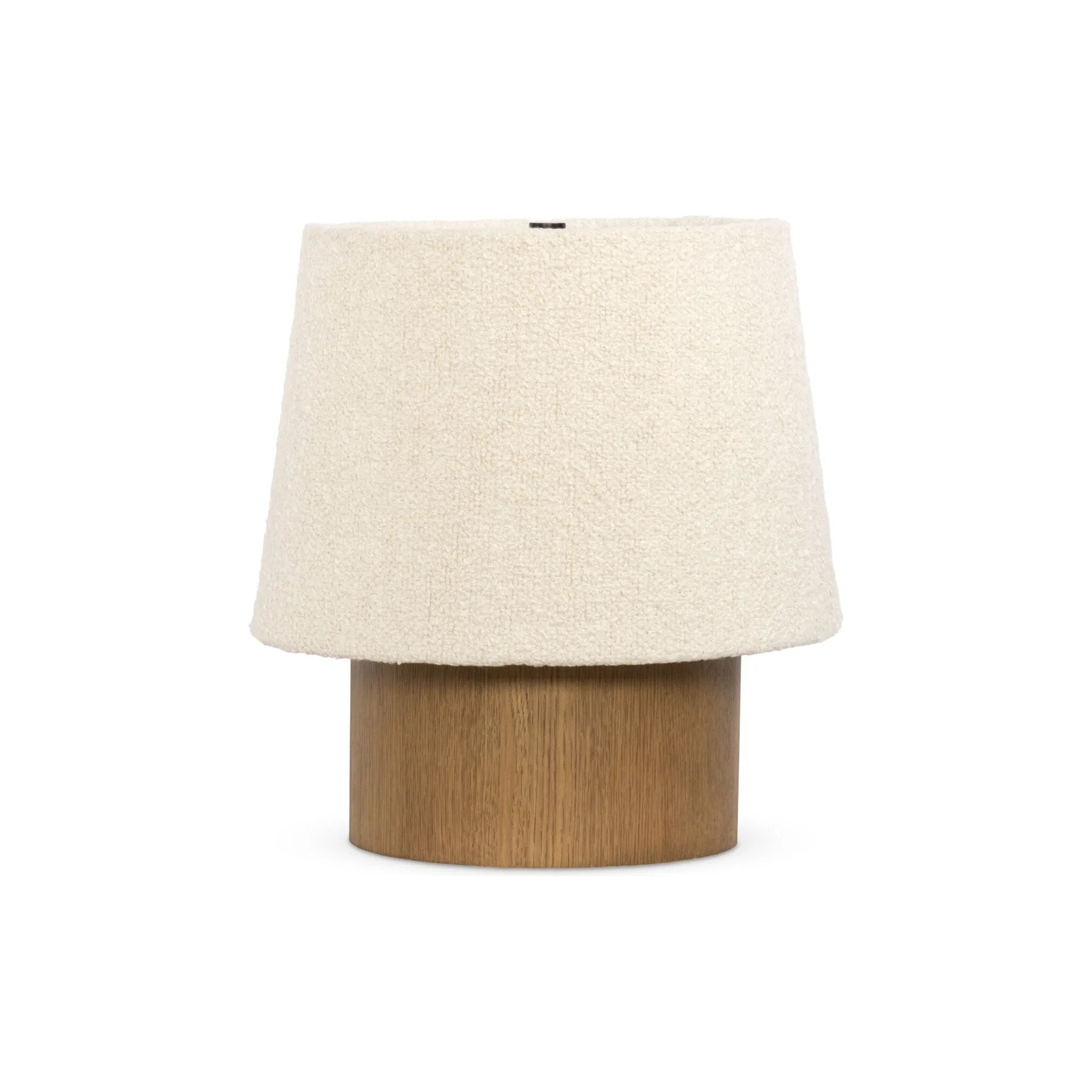 Dramatic proportions and soft texture define this unique table lamp. Light, smoked oak shapes a cylinder base for an overscaled boucle shade, bringing a playful, monochromatic look to any space Amethyst Home provides interior design, new home construction design consulting, vintage area rugs, and lighting in the Los Angeles metro area.