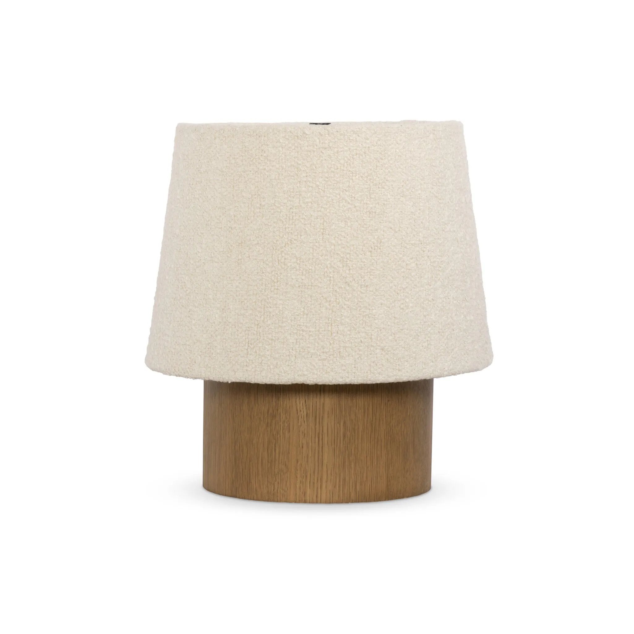 Dramatic proportions and soft texture define this unique table lamp. Light, smoked oak shapes a cylinder base for an overscaled boucle shade, bringing a playful, monochromatic look to any space Amethyst Home provides interior design, new home construction design consulting, vintage area rugs, and lighting in the Park City metro area.