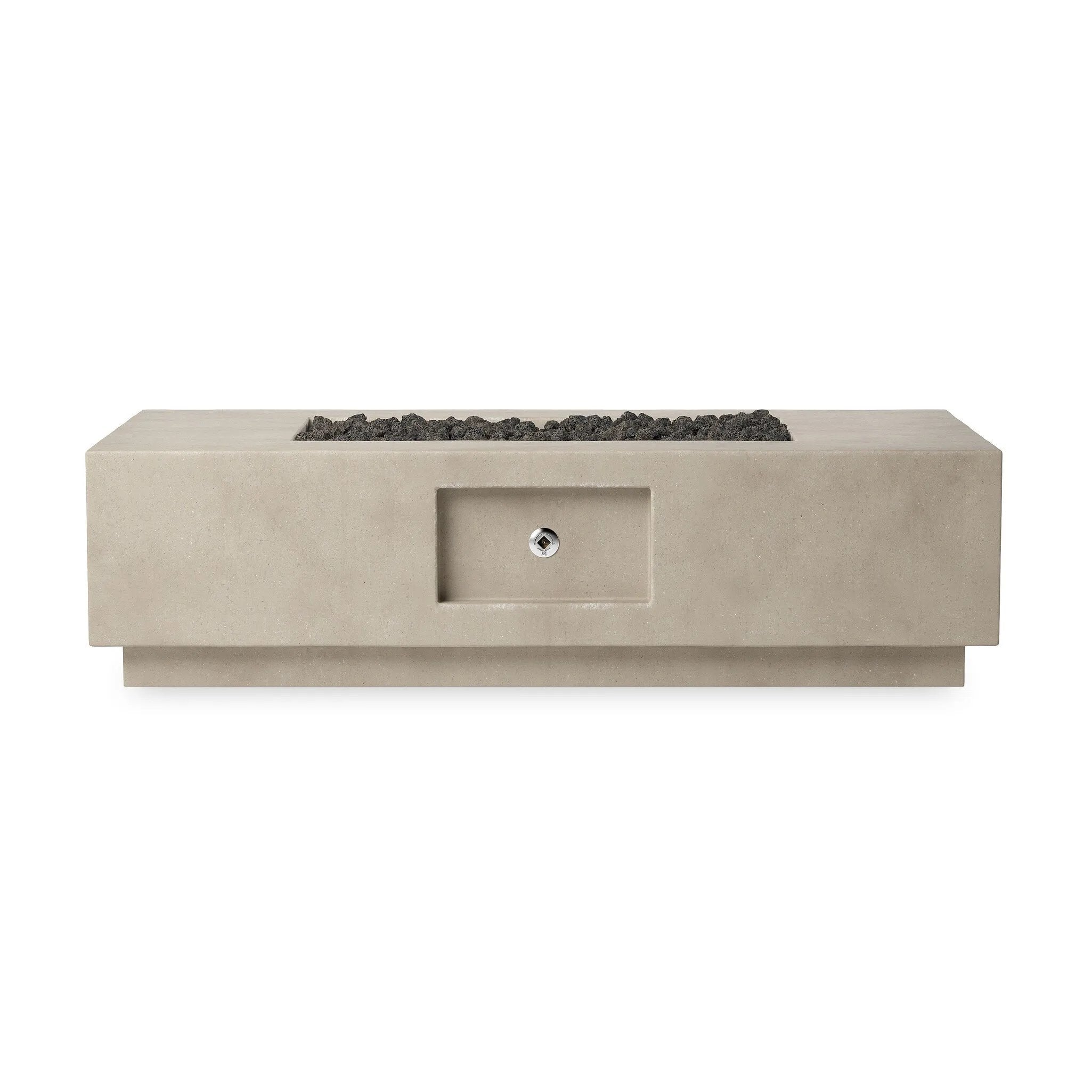 This outdoor fire table is a welcoming centerpiece designed for gathering. Made from glass-reinforced concrete, each piece is naturally finished with deep tones of pewter and dark grey. The monolithic shape is completed with lavastones in the center, bringing together a bold, monochromatic look. Amethyst Home provides interior design, new home construction design consulting, vintage area rugs, and lighting in the Miami metro area.