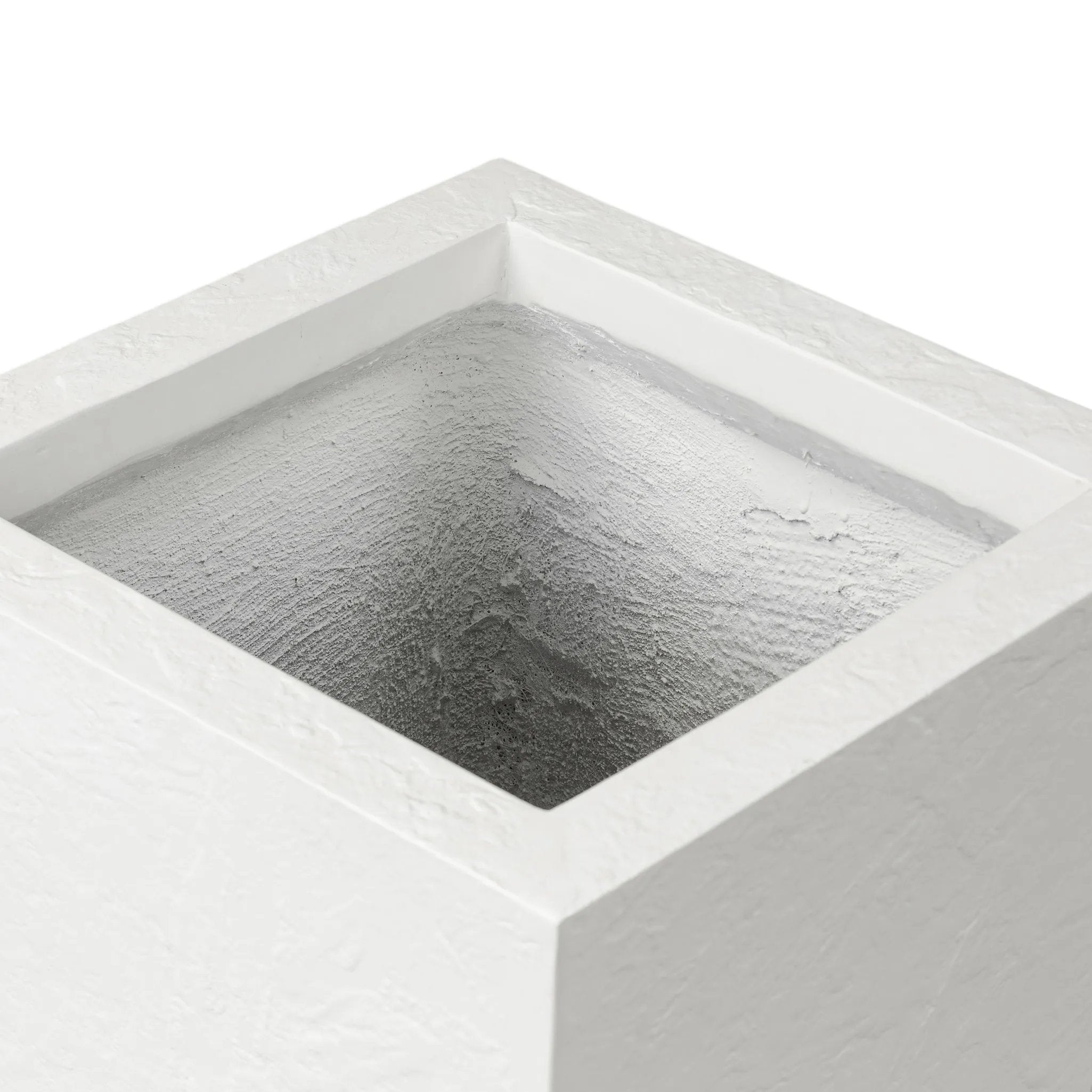 Cast black concrete forms a monolithic planter for use indoors and out. Cover or store indoors during inclement weather and when not in use Amethyst Home provides interior design, new home construction design consulting, vintage area rugs, and lighting in the Newport Beach metro area.