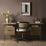 Featuring Lauren Natural Resawn Oak Desk by Four Hands at Amethyst Home. Made from solid oak and reclaimed peroba, a legal-style desk offers major storage with dual cabinetry, including file storage for legal and letter-size documents. A floating top and iron legs keep the look modern and light. This piece is designed in collaboration with Thomas Bina. Four H. Amethyst Home provides interior design, new home construction design consulting, vintage area rugs, and lighting in the Houston metro area.