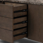 The traditional media console, elevated with mixed materials. Vein-rich marble tops an angular brown oak base, with three drawers flanked by cabinets for storage. Rear cutouts for cord management.As enthusiasts of wabi sabi design at Amethyst, we love the designer inspired Lawson Media Console. Amethyst Home provides interior design, new home construction design consulting, vintage area rugs, and lighting in the Washington metro area.