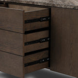 The traditional media console, elevated with mixed materials. Vein-rich marble tops an angular brown oak base, with three drawers flanked by cabinets for storage. Rear cutouts for cord management.As enthusiasts of wabi sabi design at Amethyst, we love the designer inspired Lawson Media Console. Amethyst Home provides interior design, new home construction design consulting, vintage area rugs, and lighting in the Washington metro area.