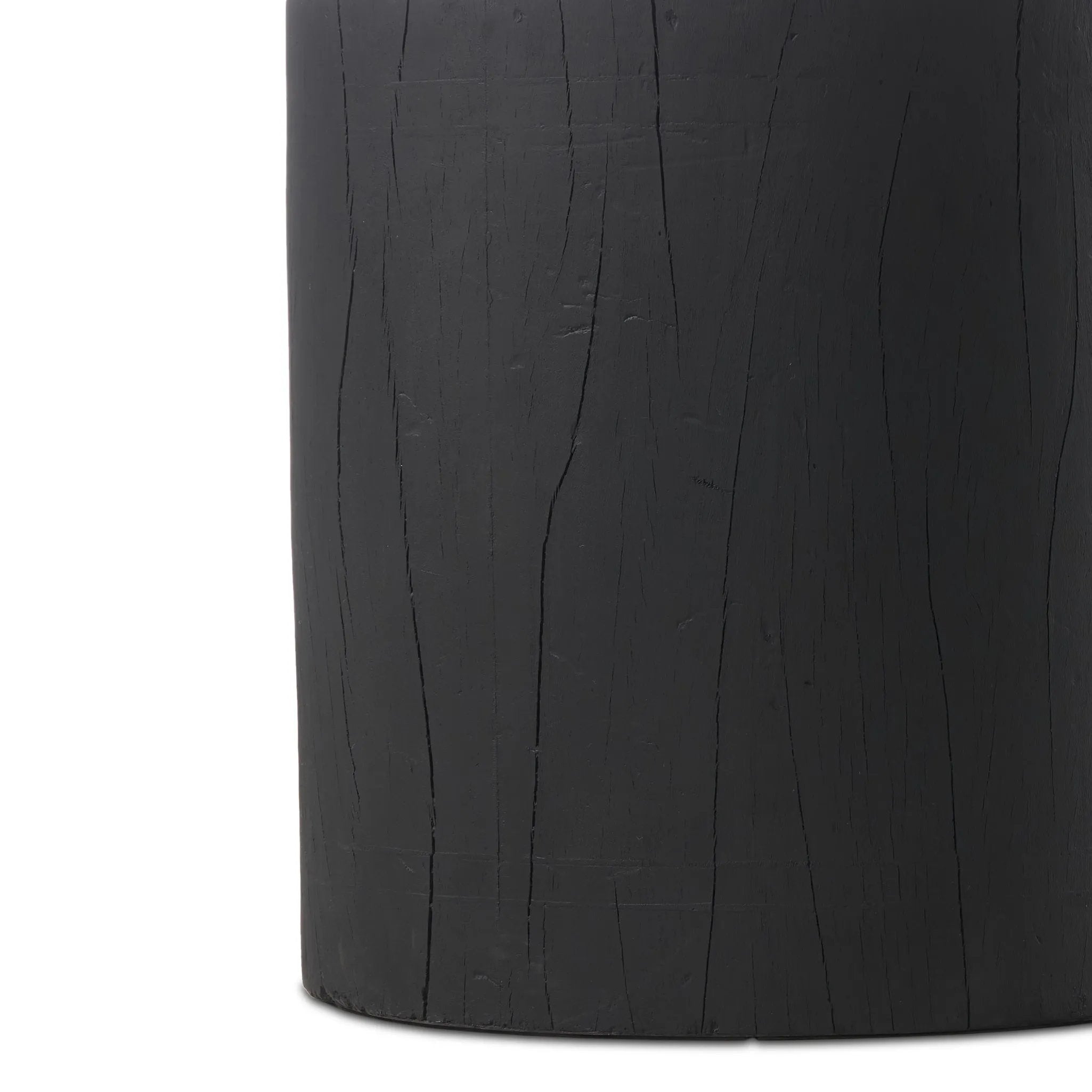 Ground any room with a style inspired by the beautiful simplicity of nature. Made of black-finished resin, the form for this special piece is molded from a tree trunk that's been cut into a circle, then cast in resin to recreate the same  texture of the trunk, even the saw marks where it was cut — talk about a true statement piece Amethyst Home provides interior design, new home construction design consulting, vintage area rugs, and lighting in the Houston metro area.