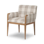 Featuring Ledger Dresden Pebble Dining Chair by Four Hands at Amethyst Home. A patterned dining chair that’s all about comfort. Checkered-print upholstery is framed by light, warm oak, while a boxy profile and higher arms feel prime for the head of the table. Overall Dimensions: 24.50"w x 26.00"d x 33.25"h. Amethyst Home provides interior design, new home construction design consulting, vintage area rugs, and lighting in the San Diego metro area.