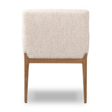 Featuring Ledger Somerton Ash Dining Chair by Four Hands at Amethyst Home. A box-profile dining chair that’s all about comfort. Exposed oak legs flow seamlessly into the chair's upholstered arms, for a seamless look. Performance fabrics are specially created to withstand spills, stains, high traffic and wear, ensuring long-term comfort and unmatched durabil. Amethyst Home provides interior design, new home construction design consulting, vintage area rugs, and lighting in the Nashville metro area.