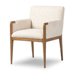Featuring Ledger Somerton Ash Dining Chair by Four Hands at Amethyst Home. A box-profile dining chair that’s all about comfort. Exposed oak legs flow seamlessly into the chair's upholstered arms, for a seamless look. Performance fabrics are specially created to withstand spills, stains, high traffic and wear, ensuring long-term comfort and unmatched durabi. Amethyst Home provides interior design, new home construction design consulting, vintage area rugs, and lighting in the Washington metro area.