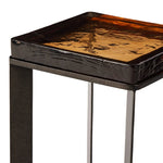 An airy, angular base of charcoal-burnished iron supports a squared tabletop of amber cast glass, perfectly sized to keep your drink or book within reach Amethyst Home provides interior design, new home construction design consulting, vintage area rugs, and lighting in the Houston metro area.