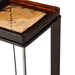 An airy, angular base of charcoal-burnished iron supports a squared tabletop of amber cast glass, perfectly sized to keep your drink or book within reach Amethyst Home provides interior design, new home construction design consulting, vintage area rugs, and lighting in the Scottsdale metro area.