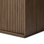 Made from rustic-finished oak with a plinth-style base, clean angles and linear reeding define this midcentury-spirited cabinet. Fully finished interior for a beautiful look inside and out. Designed in partnership with longtime Four Hands collaborator Thomas Bina and Brazilian designer Ronald Sasson. Amethyst Home provides interior design, new home construction design consulting, vintage area rugs, and lighting in the Des Moines metro area.