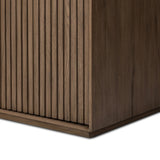 Made from rustic-finished oak with a plinth-style base, clean angles and linear reeding define this midcentury-spirited cabinet. Fully finished interior for a beautiful look inside and out. Designed in partnership with longtime Four Hands collaborator Thomas Bina and Brazilian designer Ronald Sasson. Amethyst Home provides interior design, new home construction design consulting, vintage area rugs, and lighting in the Des Moines metro area.