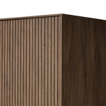 Made from rustic-finished oak with a plinth-style base, clean angles and linear reeding define this midcentury-spirited cabinet. Fully finished interior for a beautiful look inside and out. Designed in partnership with longtime Four Hands collaborator Thomas Bina and Brazilian designer Ronald Sasson. Amethyst Home provides interior design, new home construction design consulting, vintage area rugs, and lighting in the Miami metro area.