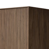 Made from rustic-finished oak with a plinth-style base, clean angles and linear reeding define this midcentury-spirited cabinet. Fully finished interior for a beautiful look inside and out. Designed in partnership with longtime Four Hands collaborator Thomas Bina and Brazilian designer Ronald Sasson. Amethyst Home provides interior design, new home construction design consulting, vintage area rugs, and lighting in the Miami metro area.