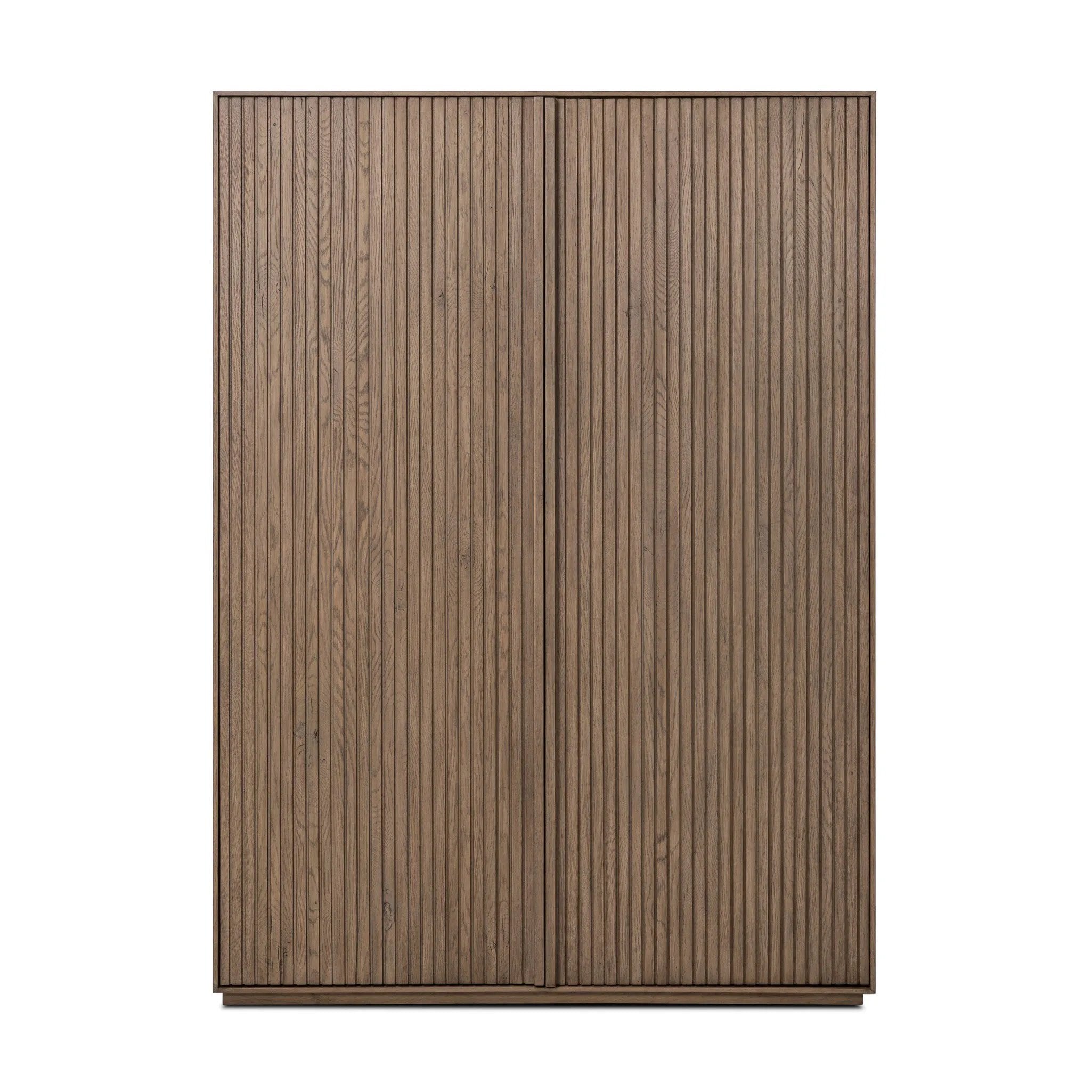 Made from rustic-finished oak with a plinth-style base, clean angles and linear reeding define this midcentury-spirited cabinet. Fully finished interior for a beautiful look inside and out. Designed in partnership with longtime Four Hands collaborator Thomas Bina and Brazilian designer Ronald Sasson. Amethyst Home provides interior design, new home construction design consulting, vintage area rugs, and lighting in the Salt Lake City metro area.