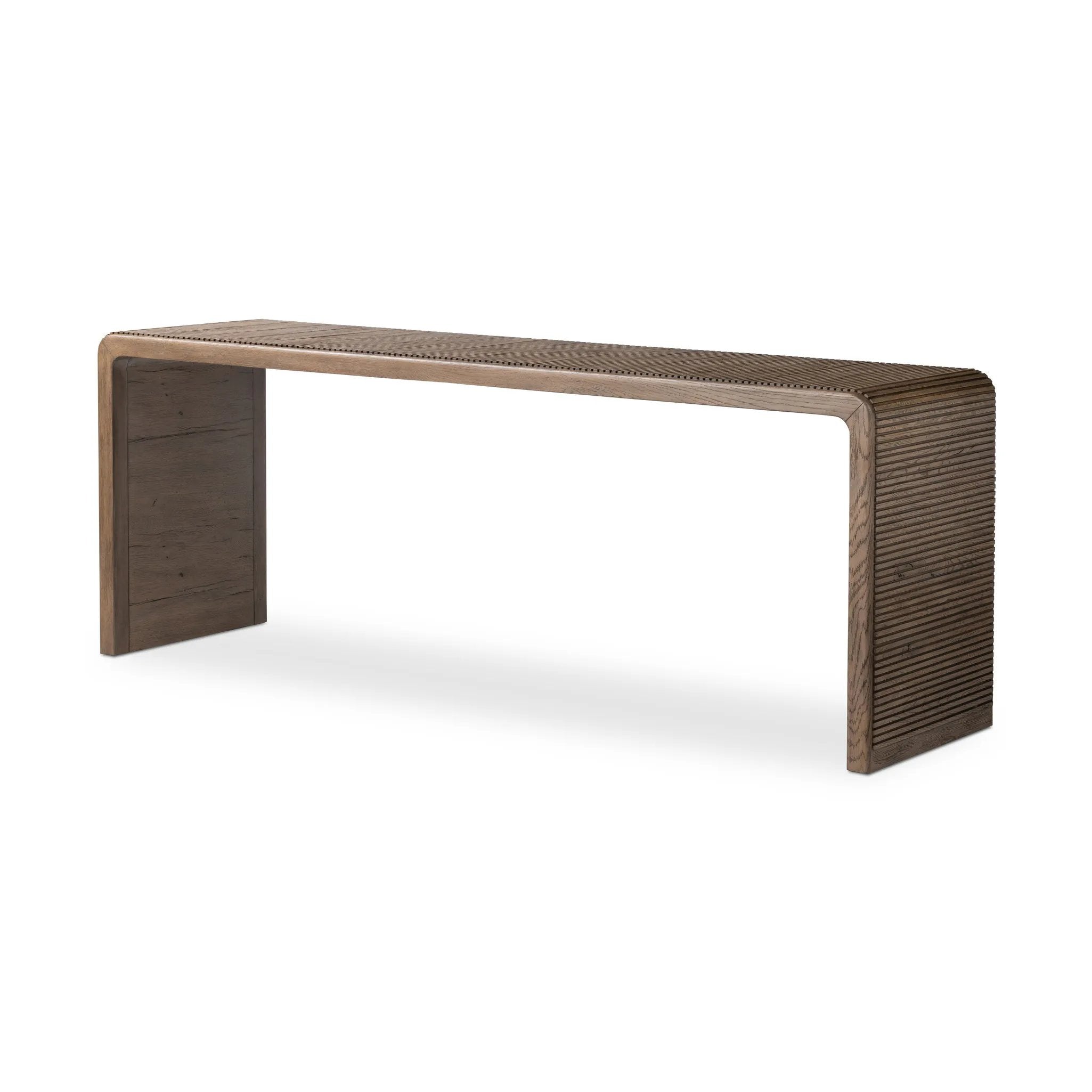 Grey-finished oak shapes an elongated console table, rich with reeding. Subtly rounded edges reflect Brazilian midcentury inspiration behind this crafted minimalist piece. Designed in partnership with longtime Four Hands collaborator Thomas Bina and designer Ronald Sasson Amethyst Home provides interior design, new home construction design consulting, vintage area rugs, and lighting in the Boston metro area.