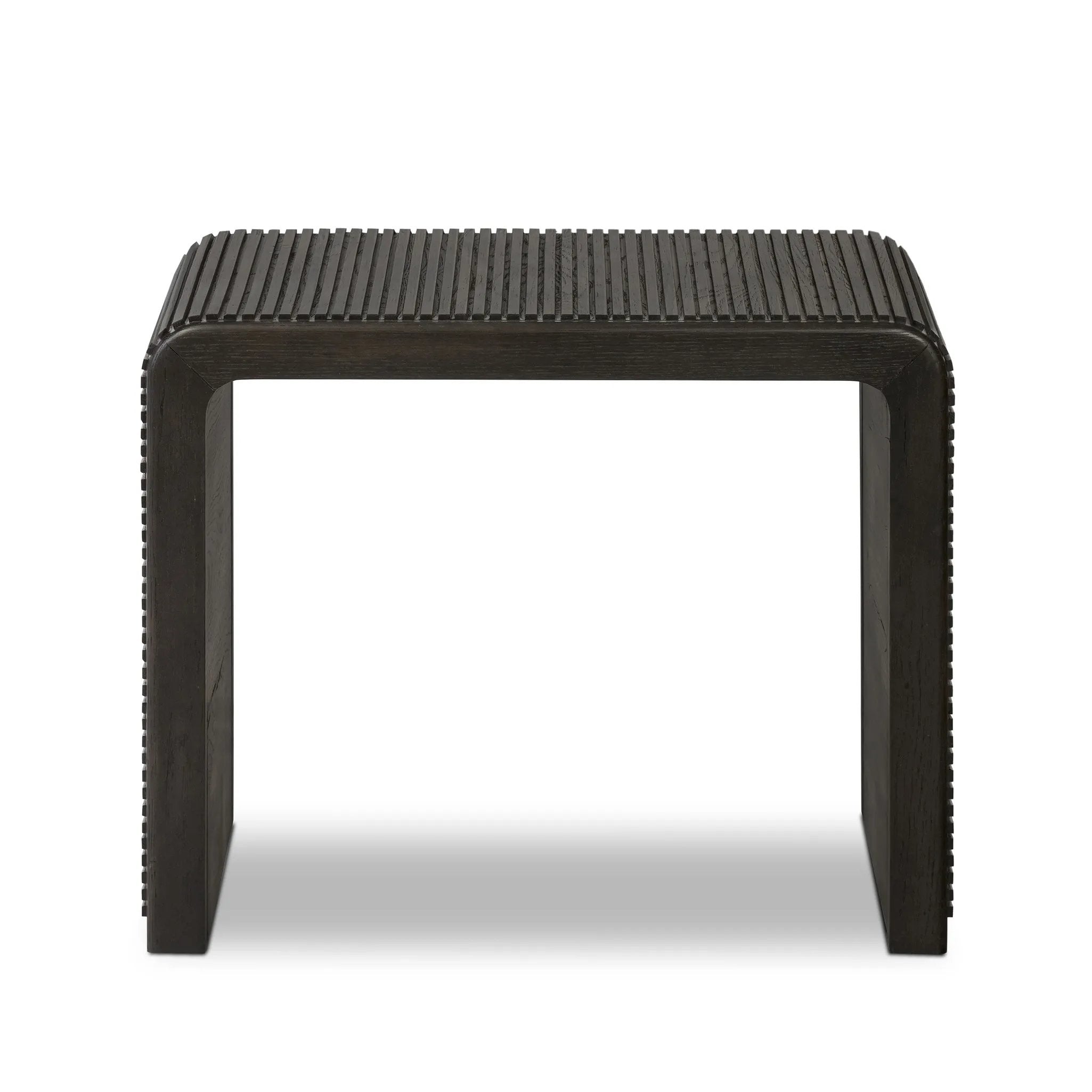 Made from smoked black oak, linear reeding and a curved shape define this midcentury-spirited end table. Designed in partnership with longtime Four Hands collaborator Thomas Bina and Brazilian designer Ronald Sasson Amethyst Home provides interior design, new home construction design consulting, vintage area rugs, and lighting in the Seattle metro area.