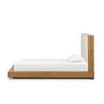 A woven, cushioned headboard in neutral cream adds texture around a floating platform base of light oak. Base features angular chamfered details, thick rails and footboard with a plinth base. Performance fabrics are specially created to withstand spills, stains, high traffic and wear, ensuring long-term comfort and unmatched durability Amethyst Home provides interior design, new home construction design consulting, vintage area rugs, and lighting in the Winter Garden metro area.