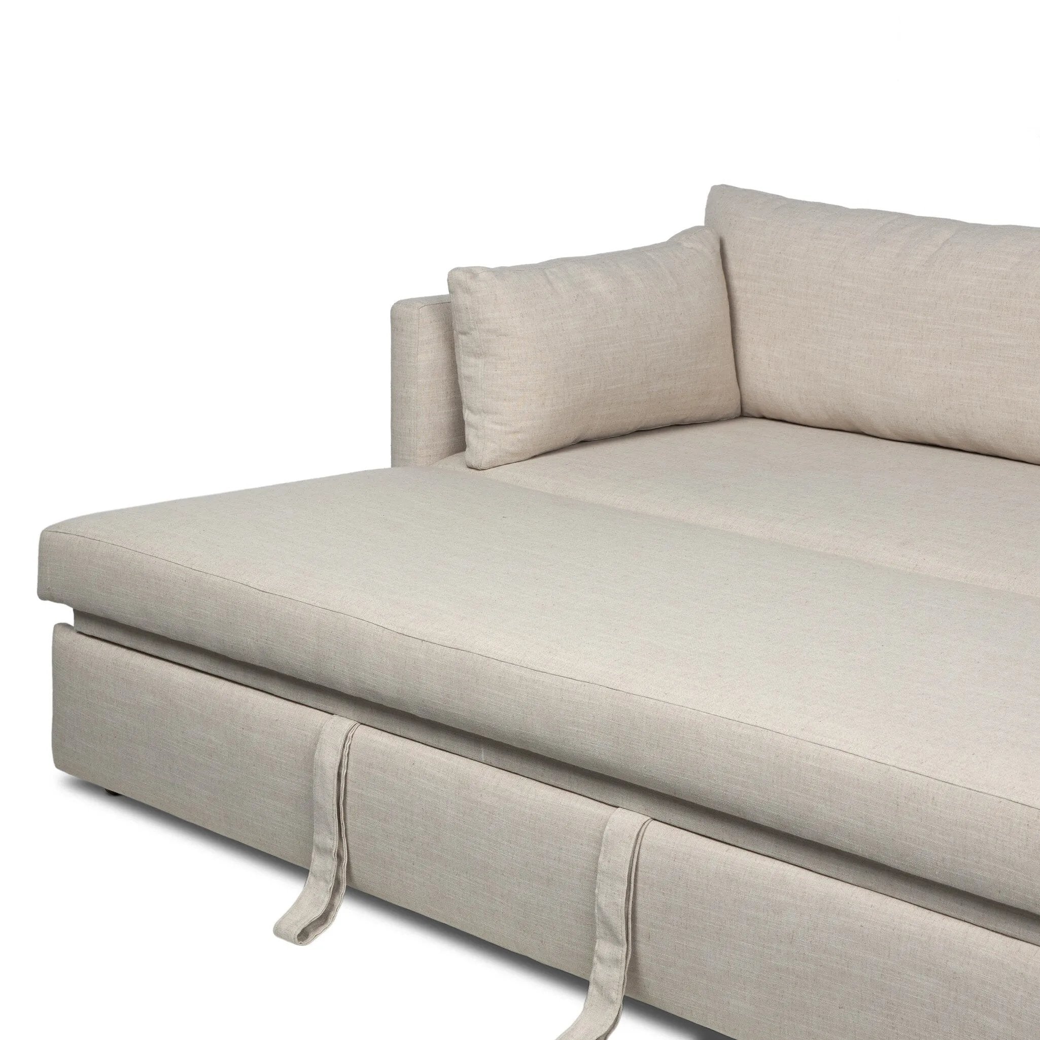This cleverly designed sleeper sofa hides a Queen-sized sleeping surface within its modern silhouette. With a simple roll-out and counterbalanced mechanism, it effortlessly transforms into a bed, making it a space-saving solution with hidden functionality. Amethyst Home provides interior design, new home construction design consulting, vintage area rugs, and lighting in the Omaha metro area.