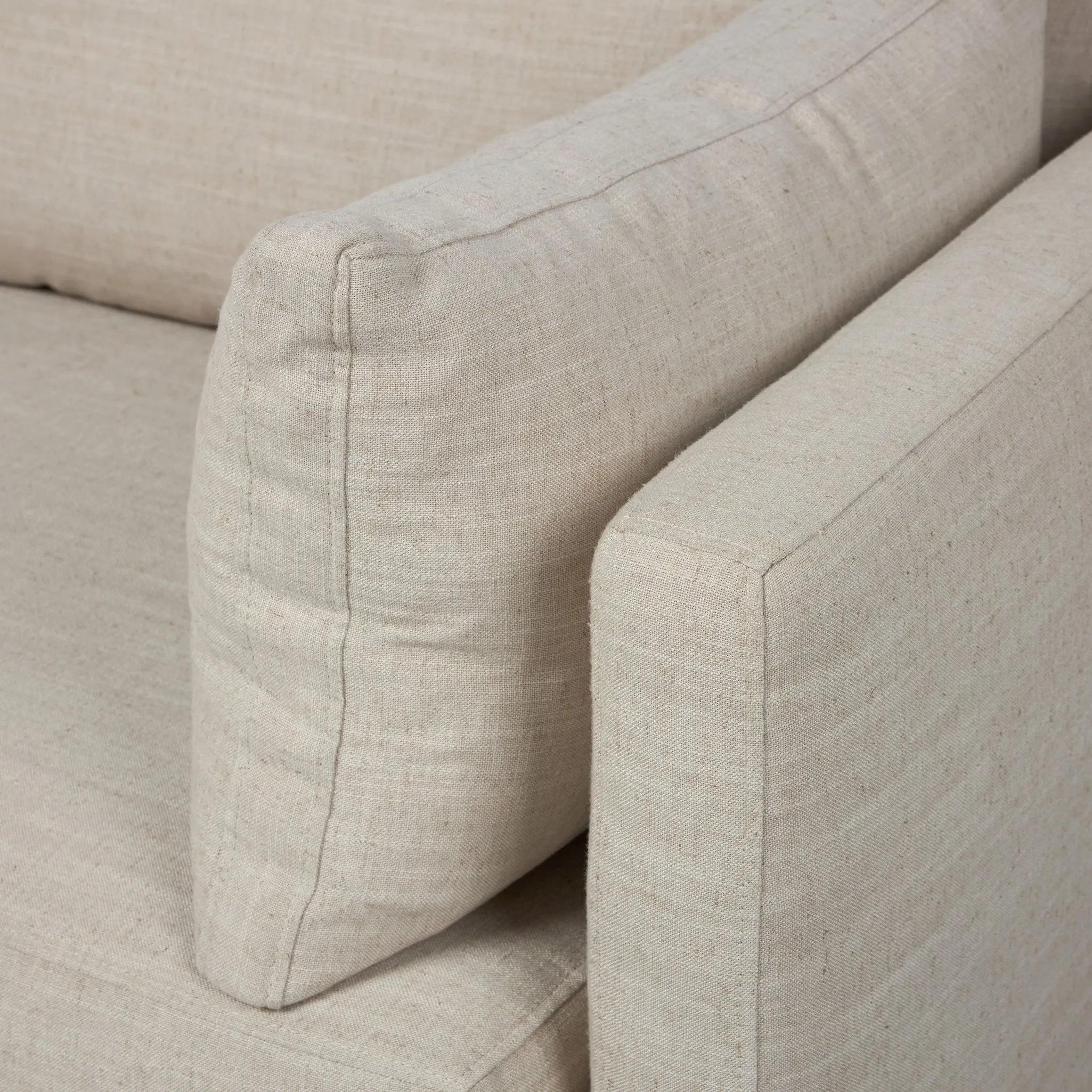 Featuring Lincoln Savoy Parchment Sofa by Four Hands at Amethyst Home. With its sleek profile and clean lines, this sofa is designed for effortless comfort and everyday lounging. Thin track arms and loose arm pillows bring a tailored, modern feel, while supportive cushions and S-spring suspension ensure it’s as inviting as it is versatile.Overall Dimensions: . Amethyst Home provides interior design, new home construction design consulting, vintage area rugs, and lighting in the Houston metro area.