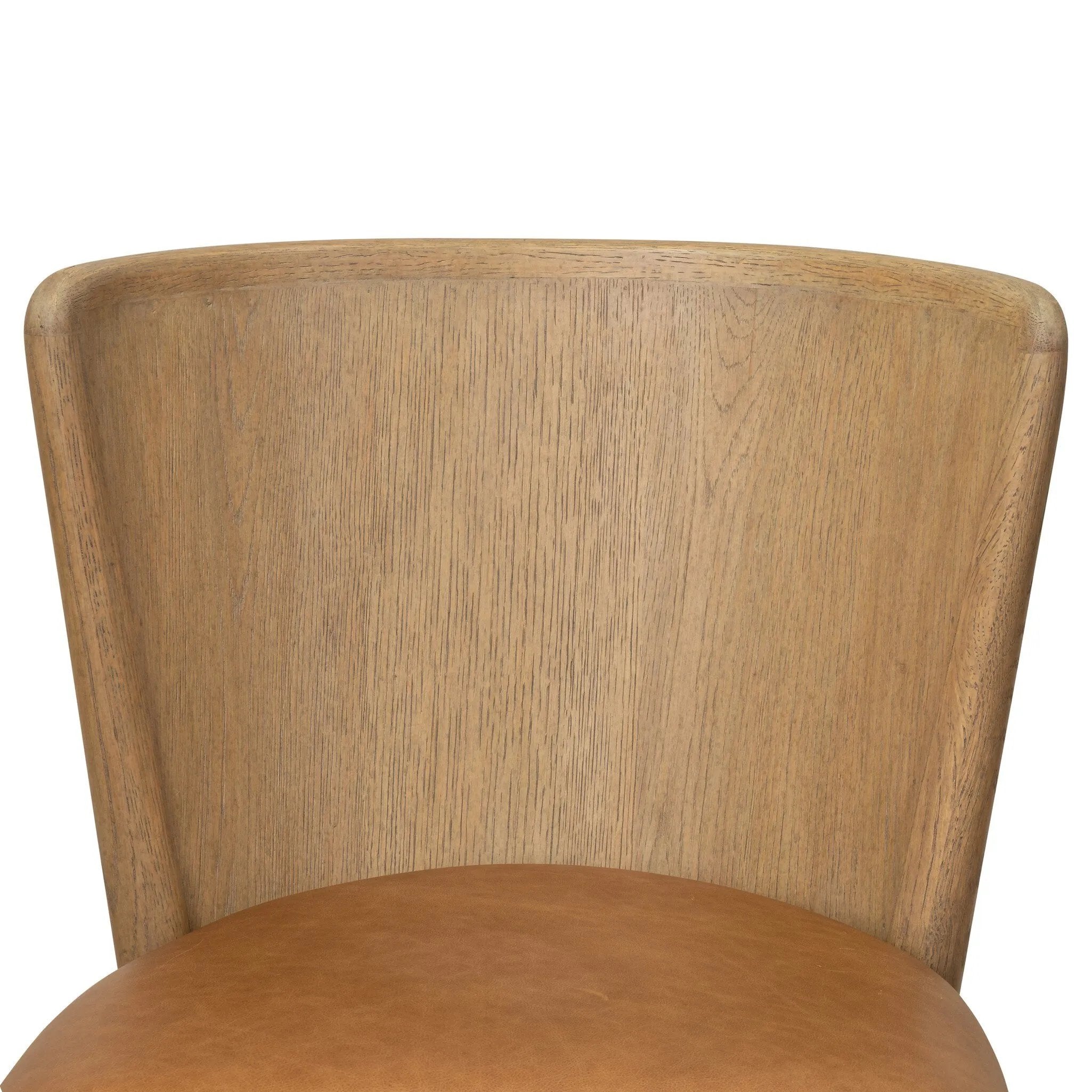 The barrel back dining chair, refreshed. Light oak shapes an armless frame and curved rear legs that almost appear to flow into the seat back. A comfy seat is upholstered in chestnut top-grain leather, while reeding details on the back create a sense of perception play. Amethyst Home provides interior design, new home construction design consulting, vintage area rugs, and lighting in the Monterey metro area.