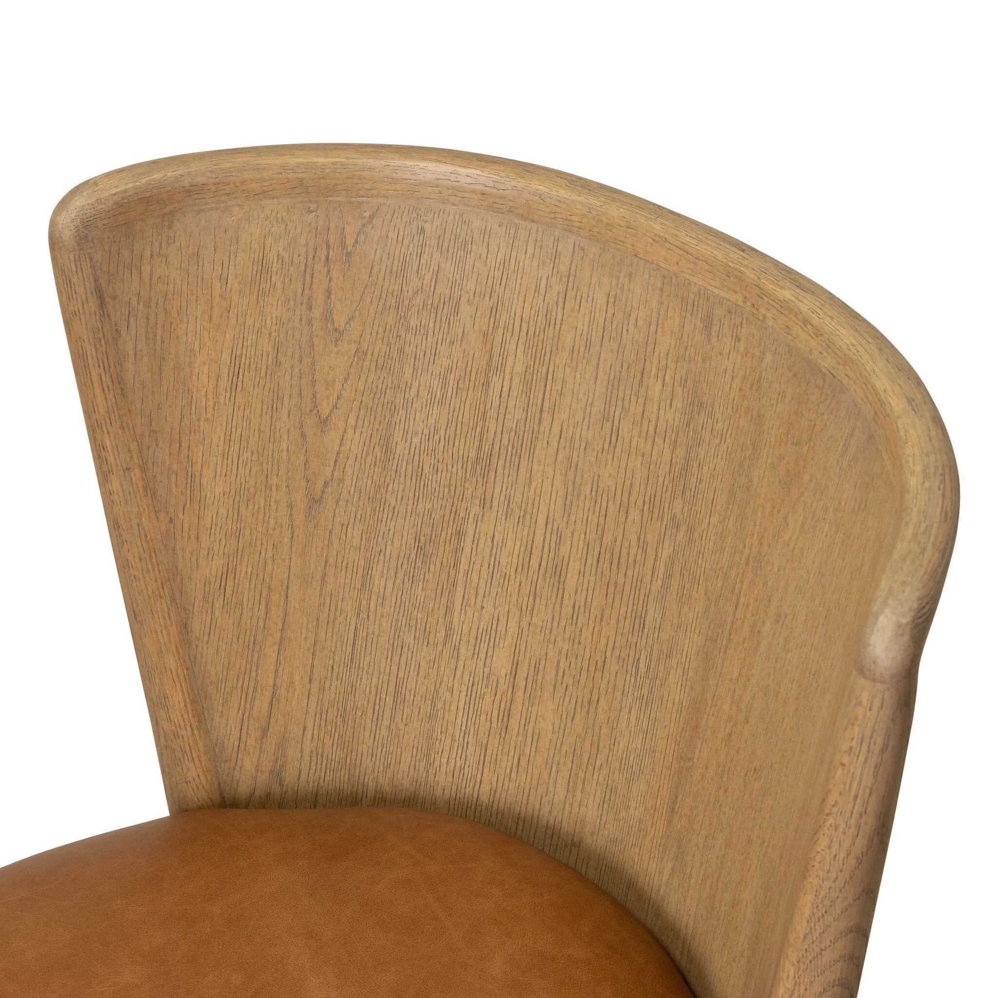 The barrel back dining chair, refreshed. Light oak shapes an armless frame and curved rear legs that almost appear to flow into the seat back. A comfy seat is upholstered in chestnut top-grain leather, while reeding details on the back create a sense of perception play. Amethyst Home provides interior design, new home construction design consulting, vintage area rugs, and lighting in the Nashville metro area.