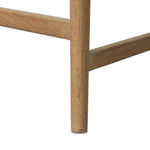 The barrel back counter stool, refreshed. Light oak shapes an armless frame and curved rear legs that almost appear to flow into the seat back. A comfy seat is upholstered in high-performance fabric, while reeding details create a sense of perception play. Amethyst Home provides interior design, new home construction design consulting, vintage area rugs, and lighting in the Charlotte metro area.