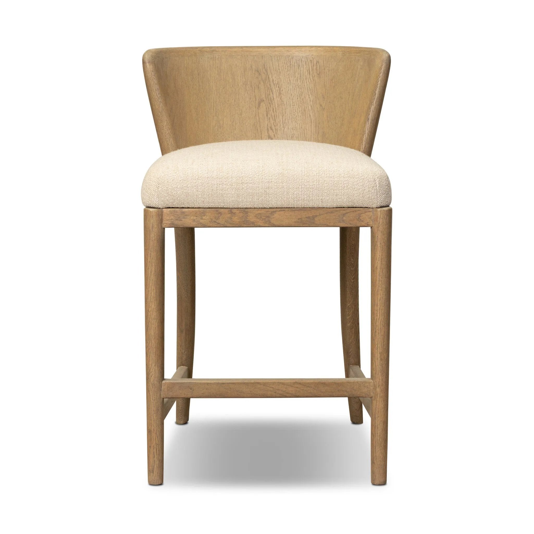 The barrel back counter stool, refreshed. Light oak shapes an armless frame and curved rear legs that almost appear to flow into the seat back. A comfy seat is upholstered in high-performance fabric, while reeding details create a sense of perception play. Amethyst Home provides interior design, new home construction design consulting, vintage area rugs, and lighting in the Houston metro area.
