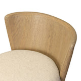 The barrel back counter stool, refreshed. Light oak shapes an armless frame and curved rear legs that almost appear to flow into the seat back. A comfy seat is upholstered in high-performance fabric, while reeding details create a sense of perception play. Amethyst Home provides interior design, new home construction design consulting, vintage area rugs, and lighting in the Park City metro area.