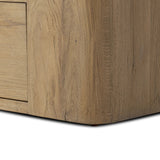 A clean, wide storage style crafted of aged natural oak brings a Brutalist look to any room. Plenty of open shelving offers endless options for favorite books and treasures, while a lower push-latch drawer finishes the look Amethyst Home provides interior design, new home construction design consulting, vintage area rugs, and lighting in the Boston metro area.