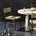Featuring Lomas Textured Dune Outdoor Metal Dining Chair by Four Hands at Amethyst Home. Make a bold statement with contrasting materials. Slim, tapered metal frames this woven all-weather wicker outdoor dining chair. Cover or store indoors during inclement weather and when not in use. Overall Dimensions: 19.00"w x 23.00"d x 34.00"h. Amethyst Home provides interior design, new home construction design consulting, vintage area rugs, and lighting in the Dallas metro area.