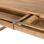 Featuring Lorik Caramel Rubberwood Desk by Four Hands at Amethyst Home. Wabi Sabi-inspired and designed with a clean, bold shape. This rustic desk features a modernized shape crafted from caramel-finished wood. Designed with cylindrical legs that are both angled and tapered for added movement. Built-in, hidden pencil drawers keep the focus on the natural grain. Amethyst Home provides interior design, new home construction design consulting, vintage area rugs, and lighting in the Dallas metro area.