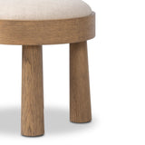 A simple, charming stool with an oak wood veneer finish and performance fabric-upholstered seat. Tapered legs add subtle character. Performance fabrics are specially created to withstand spills, stains, high traffic and wear, ensuring long-term comfort and unmatched durability. Amethyst Home provides interior design, new home construction design consulting, vintage area rugs, and lighting in the Charlotte metro area.