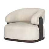 A playful outdoor chair silhouette with a 360 swivel base. The yolk-shaped back is framed by sleek metal accents, adding visual contrast to the exploded boucle upholstery on the thick seat cushion and curved back. Cover or store inside during inclement weather and when not in use. Amethyst Home provides interior design, new home construction design consulting, vintage area rugs, and lighting in the Kansas City metro area.
