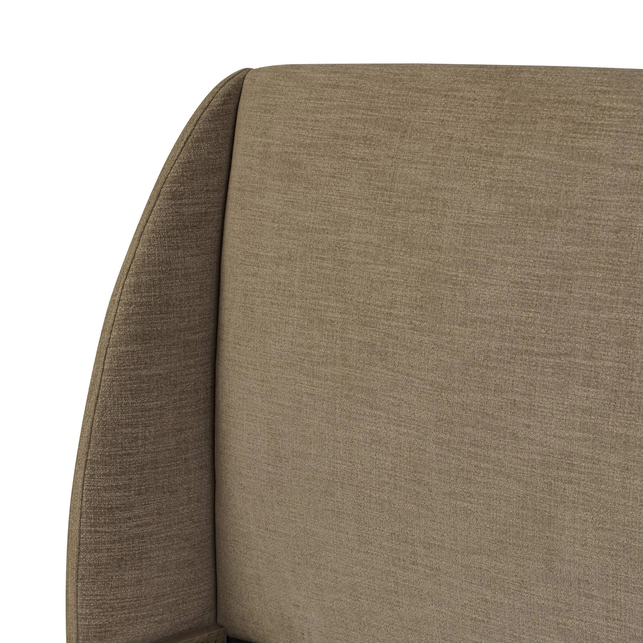 Clean lines meet contoured curves for a timeless bedroom look. A petal-shaped shelter overlaps side rails for a unique,  comforting silhouette. Fully upholstered in a versatile taupe that complements a wide range of color palettes, all grounded by a rich oak base Amethyst Home provides interior design, new home construction design consulting, vintage area rugs, and lighting in the Houston metro area.