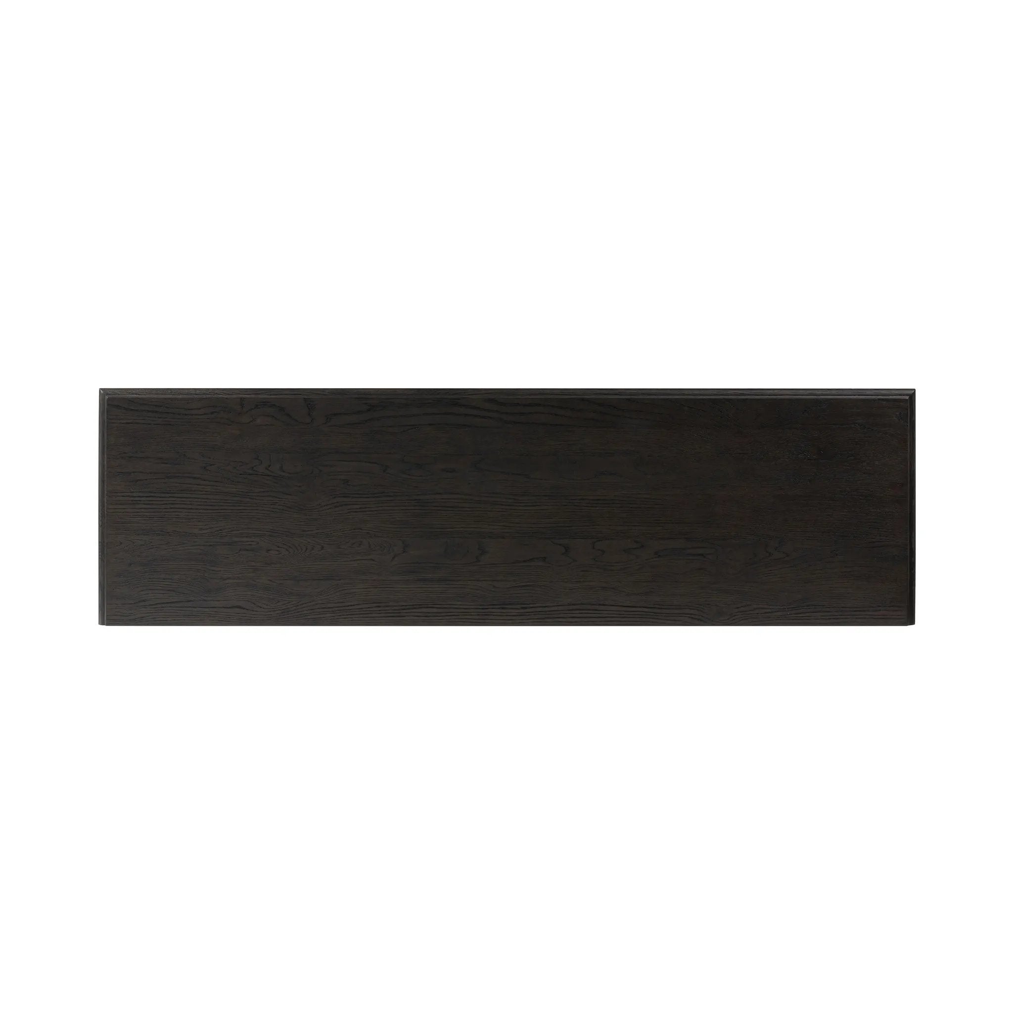 A cleanly shaped six-drawer dresser is crafted from smoked black oak, highlighting the wood's natural grain. Roomy drawers offer plenty of space for bedroom storage, while the slim, tapered legs give the piece a subtle lift, creating a grounded look Amethyst Home provides interior design, new home construction design consulting, vintage area rugs, and lighting in the Alpharetta metro area.