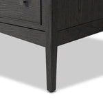 A cleanly shaped six-drawer dresser is crafted from smoked black oak, highlighting the wood's natural grain. Roomy drawers offer plenty of space for bedroom storage, while the slim, tapered legs give the piece a subtle lift, creating a grounded look Amethyst Home provides interior design, new home construction design consulting, vintage area rugs, and lighting in the Des Moines metro area.