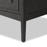 A cleanly shaped six-drawer dresser is crafted from smoked black oak, highlighting the wood's natural grain. Roomy drawers offer plenty of space for bedroom storage, while the slim, tapered legs give the piece a subtle lift, creating a grounded look Amethyst Home provides interior design, new home construction design consulting, vintage area rugs, and lighting in the Des Moines metro area.