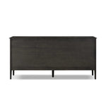 A cleanly shaped six-drawer dresser is crafted from smoked black oak, highlighting the wood's natural grain. Roomy drawers offer plenty of space for bedroom storage, while the slim, tapered legs give the piece a subtle lift, creating a grounded look Amethyst Home provides interior design, new home construction design consulting, vintage area rugs, and lighting in the Kansas City metro area.