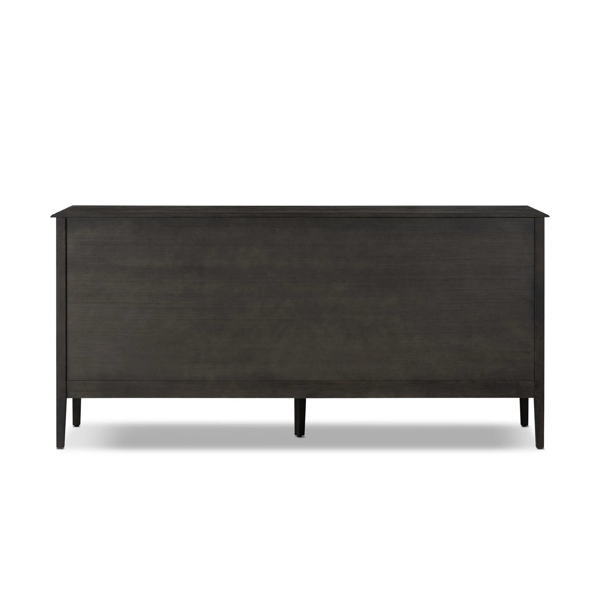 A cleanly shaped six-drawer dresser is crafted from smoked black oak, highlighting the wood's natural grain. Roomy drawers offer plenty of space for bedroom storage, while the slim, tapered legs give the piece a subtle lift, creating a grounded look Amethyst Home provides interior design, new home construction design consulting, vintage area rugs, and lighting in the Kansas City metro area.