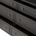 A cleanly shaped six-drawer dresser is crafted from smoked black oak, highlighting the wood's natural grain. Roomy drawers offer plenty of space for bedroom storage, while the slim, tapered legs give the piece a subtle lift, creating a grounded look Amethyst Home provides interior design, new home construction design consulting, vintage area rugs, and lighting in the Los Angeles metro area.