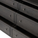 A cleanly shaped six-drawer dresser is crafted from smoked black oak, highlighting the wood's natural grain. Roomy drawers offer plenty of space for bedroom storage, while the slim, tapered legs give the piece a subtle lift, creating a grounded look Amethyst Home provides interior design, new home construction design consulting, vintage area rugs, and lighting in the Los Angeles metro area.