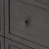 A cleanly shaped six-drawer dresser is crafted from smoked black oak, highlighting the wood's natural grain. Roomy drawers offer plenty of space for bedroom storage, while the slim, tapered legs give the piece a subtle lift, creating a grounded look Amethyst Home provides interior design, new home construction design consulting, vintage area rugs, and lighting in the Monterey metro area.