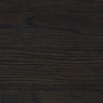 A cleanly shaped six-drawer dresser is crafted from smoked black oak, highlighting the wood's natural grain. Roomy drawers offer plenty of space for bedroom storage, while the slim, tapered legs give the piece a subtle lift, creating a grounded look Amethyst Home provides interior design, new home construction design consulting, vintage area rugs, and lighting in the Nashville metro area.