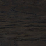 A cleanly shaped six-drawer dresser is crafted from smoked black oak, highlighting the wood's natural grain. Roomy drawers offer plenty of space for bedroom storage, while the slim, tapered legs give the piece a subtle lift, creating a grounded look Amethyst Home provides interior design, new home construction design consulting, vintage area rugs, and lighting in the Nashville metro area.