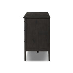 A cleanly shaped six-drawer dresser is crafted from smoked black oak, highlighting the wood's natural grain. Roomy drawers offer plenty of space for bedroom storage, while the slim, tapered legs give the piece a subtle lift, creating a grounded look Amethyst Home provides interior design, new home construction design consulting, vintage area rugs, and lighting in the Salt Lake City metro area.